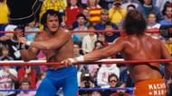 Honky Tonk Man prepares to way lay Randy Savage with his signature guitar.